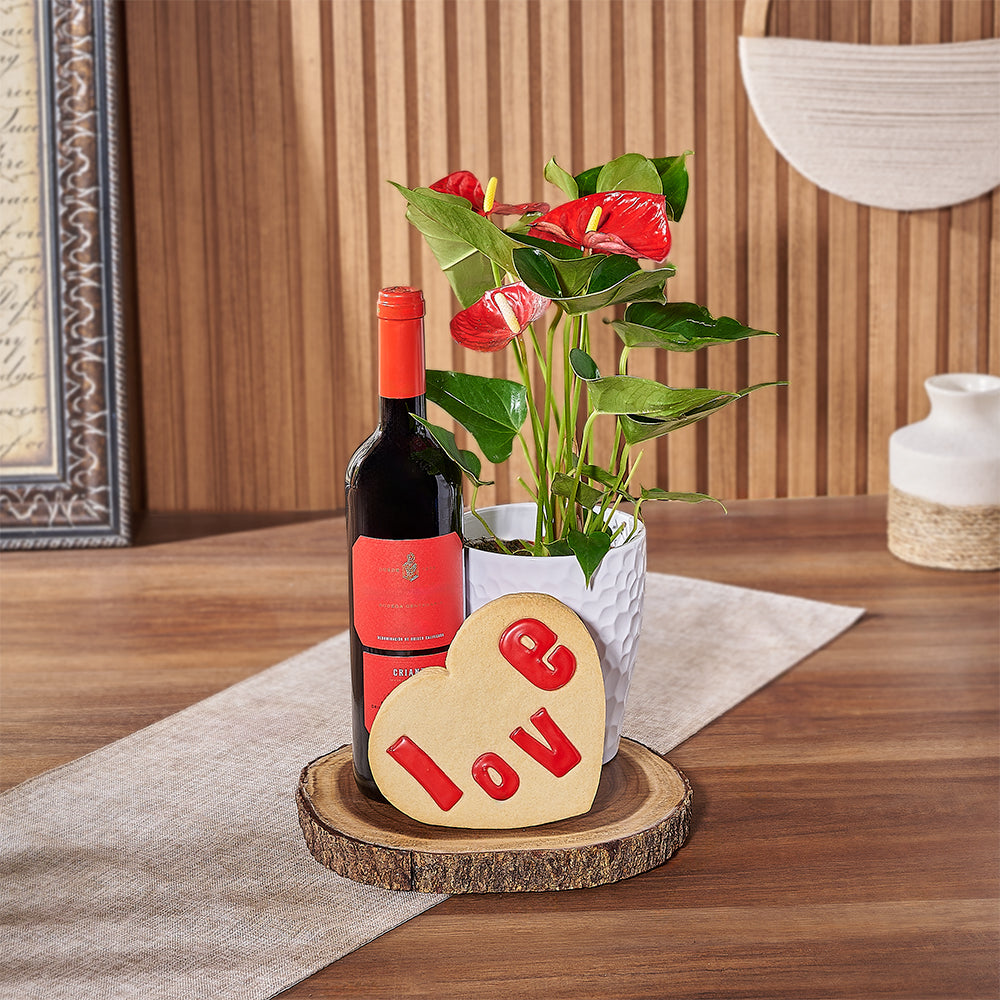 This Valentine's Day, show someone special they're on your mind with a bottle of wine, a potted Anthurium plant, a heart-shaped cookie that says ‘love’, and a live-edge serving board, Connecticut delivery