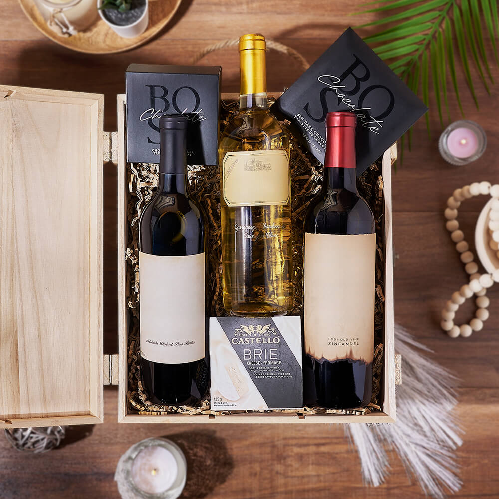 three wines in a box with cheese and chocolates gift basket